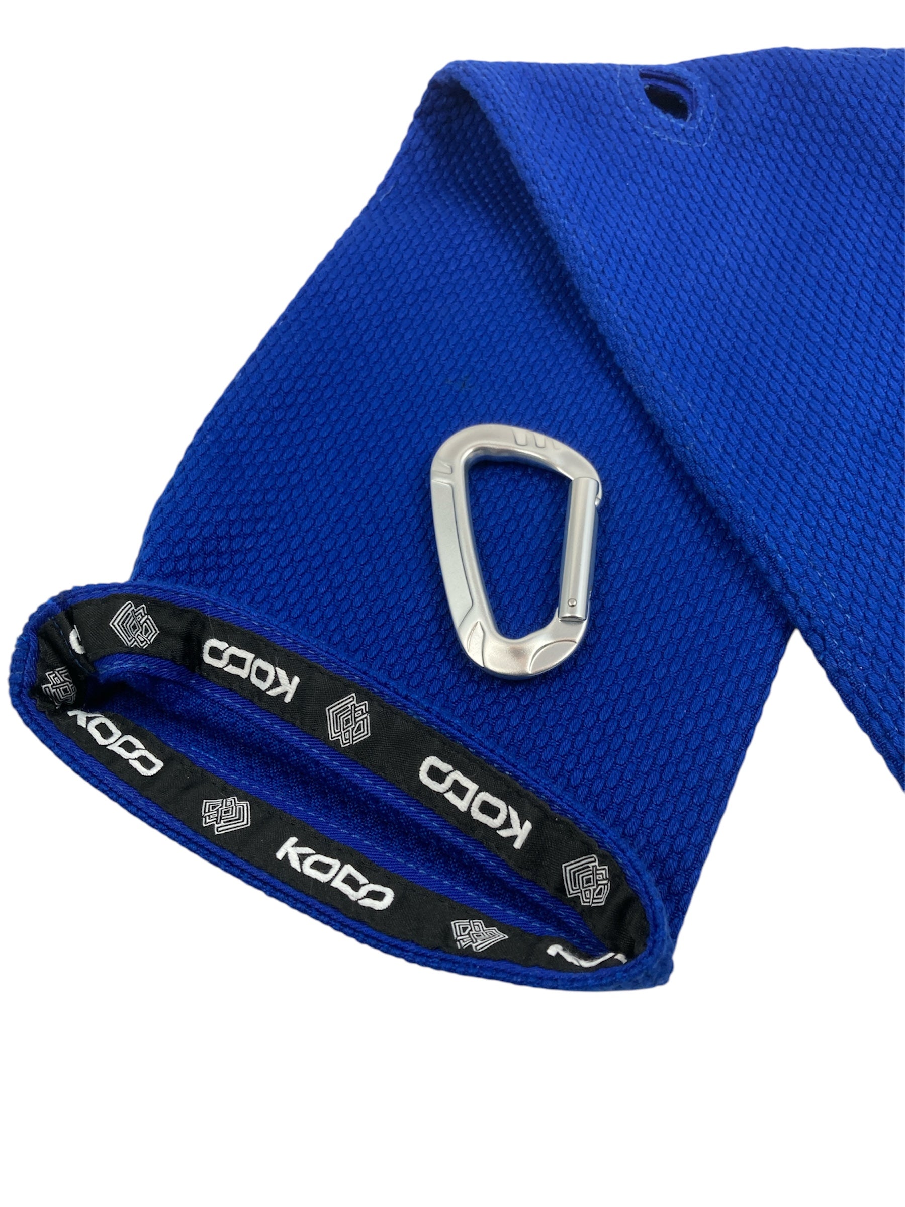 Blue Kodo Gi Grip with embroidered logo, featuring a custom aluminum carabiner attached to it used for martial arts such as BJJ and Judo and Grip Strength. These are premium Jiu Jitsu Grip trainers and Judo Grip Trainers.