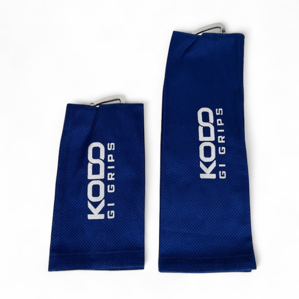 Blue Kodo Gi Grip with embroidered logo, featuring a custom aluminum carabiner attached to it used for martial arts such as BJJ and Judo and Grip Strength. These are premium Jiu Jitsu Grip trainers and Judo Grip Trainers.