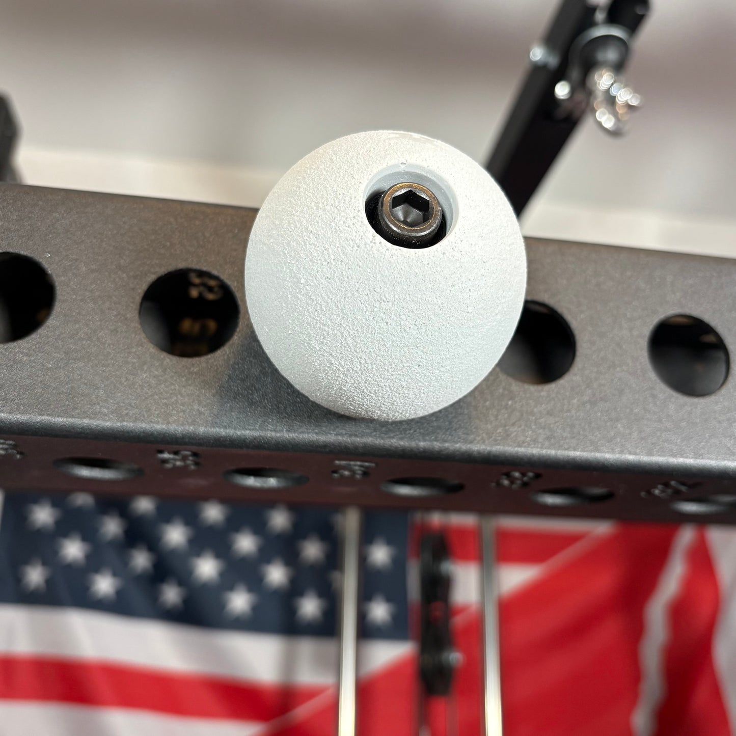 white spherical climbing holds for squat rack attachments 