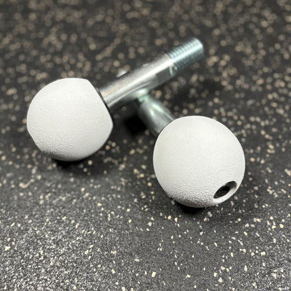 Two white spherical climbing holds for squat rack attachments 