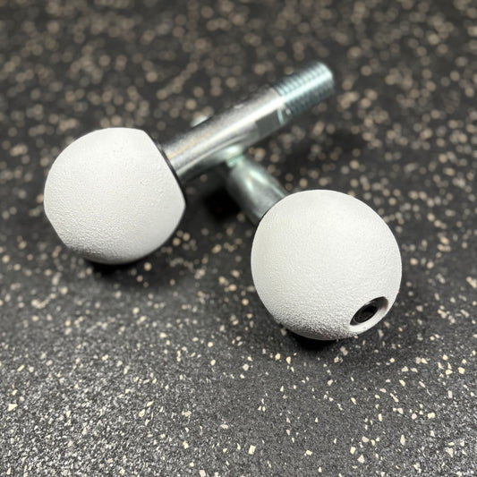 Two white spherical climbing holds for squat rack attachments 