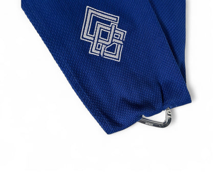 Blue Kodo Gi Grip with embroidered logo, featuring a custom aluminum carabiner attached to it used for martial arts such as BJJ and Judo and Grip Strength. These are premium Jiu Jitsu Grip trainers and Judo Grip Trainers. 